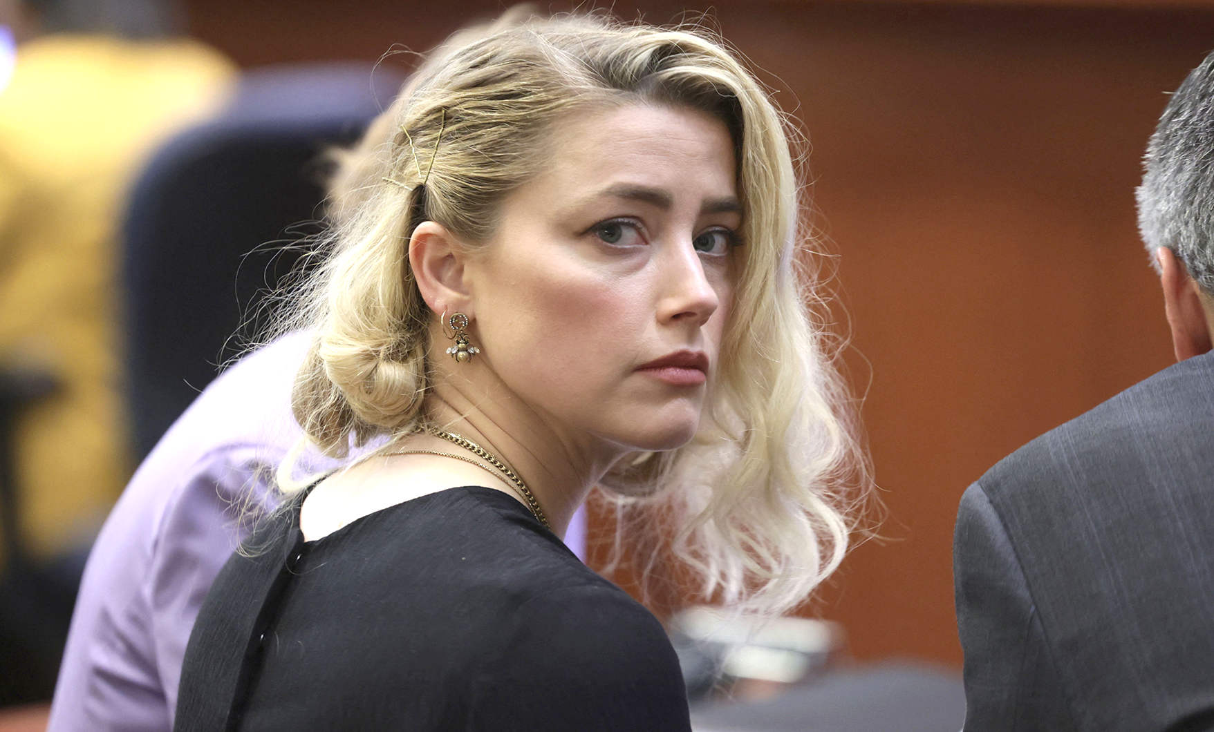 Amber Heard, plays Mera in Aquaman, seen here in court with Johhny Depp. Thank heavens all that is over with. For both parties, we imagine, a steep learning curve.